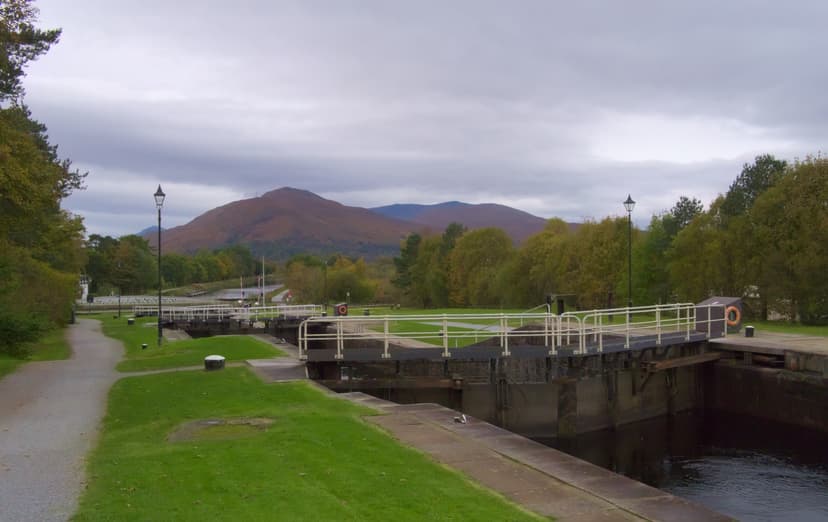 Neptune's Staircase canal locks with mountains in the background under a cloudy sky